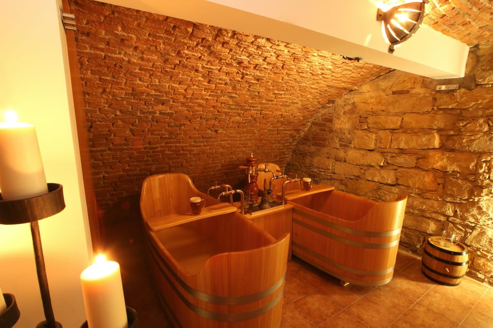 Caroline Bernard Beer Spa Prague with Beer & Massage Option - Your private setup: bath, heated bed, and a room that stays yours