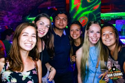 Clock Tower Bar Crawl ending at Prague's BIGGEST rooftop CLUB - The middle part: 2 to 3 stops, welcome shots, and group momentum