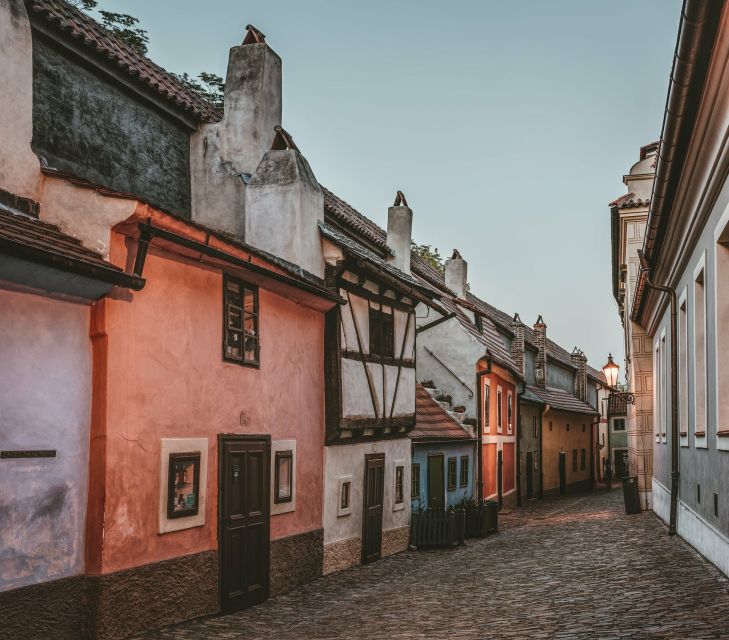 Prague: Full-Day Sightseeing Tour with Cruise and Lunch - The walk-up to Castle Town: palaces, diplomatic vibes, and big views
