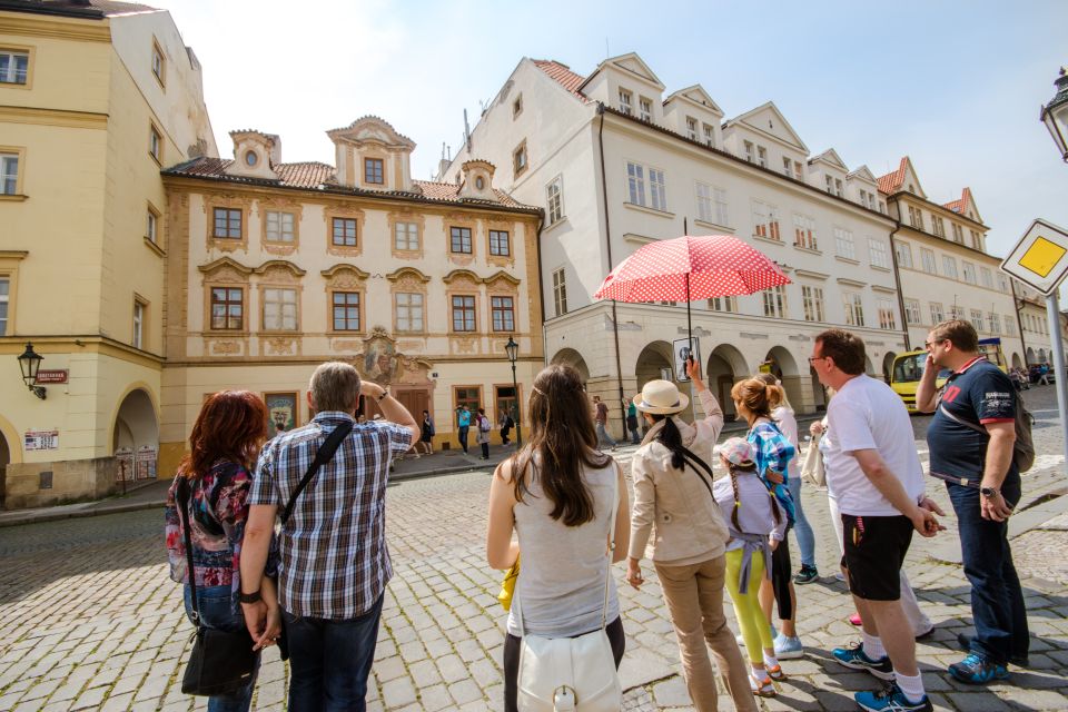 Prague: Guided Bus & Walking Tour with River Cruise & Lunch - Charles Bridge and the river approach: classic sights, explained