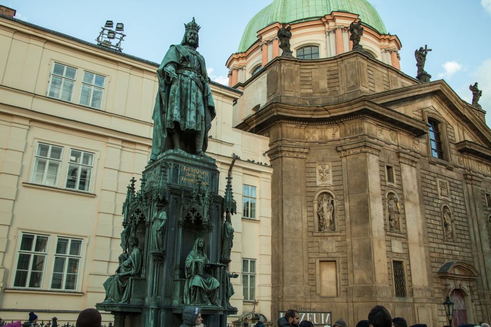 Prague: Old Town and Jewish Quarter Guided Tour in German - Clementinum and New Town Hall exteriors: a bridge between worlds